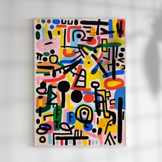 an abstract painting on a white wall with black, yellow, red and blue colors