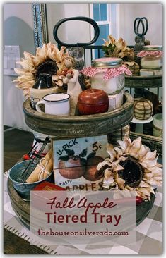 three tiered tray with sunflowers and other items