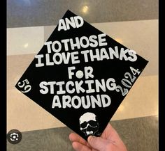 a black and white graduation cap that says and i love thanks for sticking around