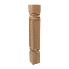 a tall wooden pillar with an intricate design on it's top and bottom part