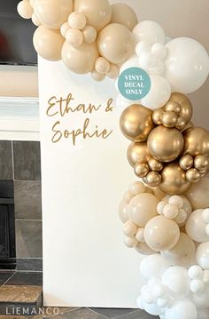 the balloon arch is decorated with white, gold and silver balloons that spell out ettay & sophiie