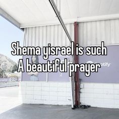 a woman standing in front of a building with the words shema ursai is such a beautiful prayer