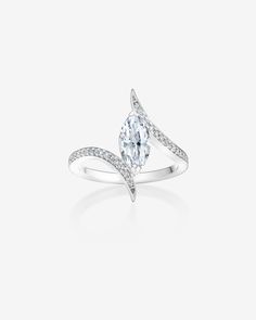 a white gold ring with a pear shaped diamond