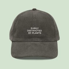 For the plant lovers who can't help but admire every leaf, the Easily Distracted by Plants Corduroy Cap is your new favorite accessory. Whether you're a proud plant parent or just have a green thumb, this cap perfectly captures your love for all things botanical. 🎨 Plant Lover's Essential Featuring the playful Easily Distracted by Plants embroidery, this cap is a stylish nod to your plant obsession. The soft corduroy fabric adds a cozy, vintage feel, making it the ideal addition to your casual Plant Hat, Cute Baseball Hats, Plant Obsession, Corduroy Cap, Gardening Hat, Western Work, Plant Parent, Easily Distracted, Plant Lover Gift