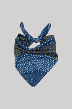 a blue bandana with yellow polka dots on it