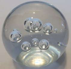 a clear glass ball with many bubbles in it