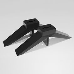 two pieces of black plastic sitting on top of each other