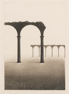 an old photo with columns in the middle and fog on the ground behind it,