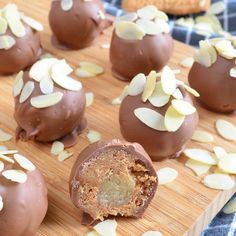 chocolate truffles with almonds on a cutting board