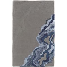 a gray rug with blue and grey waves on the top, in front of a white background