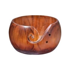 a wooden bowl with an unusual design on it