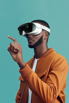 a man in an orange jacket is holding his hand up to the camera while wearing a pair of virtual glasses