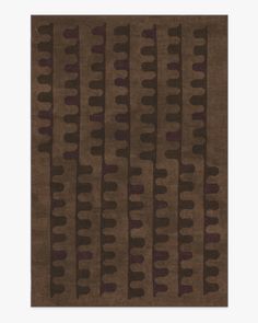 an area rug with brown and purple designs