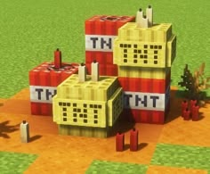 three legos sitting on top of each other in the middle of a field