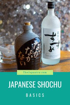 two bottles of sake on top of a wooden table with the words japanese shochu