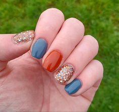 Transition Nail Colors From Summer To Fall, Teal Nails For Fall, Nail Ideas For September 2023, Navy And Orange Nails Fall, Fall Color Sns Nails, Navy And Orange Nails Design, Orange Nail Polish Designs, Powder Dip Nails For Fall, Dark Teal And Orange Nails