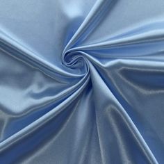 a close up shot of a blue satin fabric