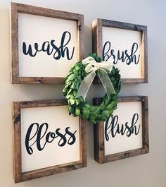 three framed wood signs with the words wash brush, floss and wreath on them