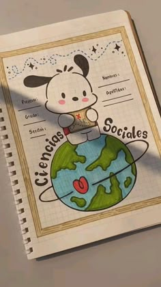 an open notebook with a drawing of a dog on top of the globe and words