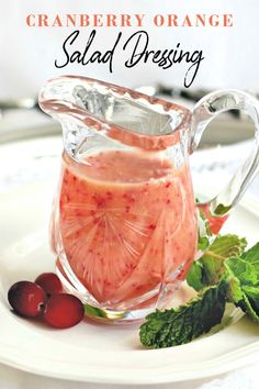 a pitcher filled with liquid sitting on top of a white plate