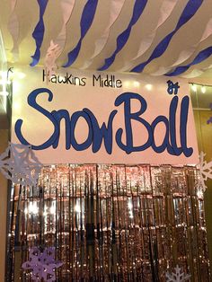 there is a sign that says snow ball hanging from the ceiling