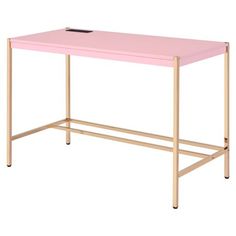 a pink desk with gold legs on a white background