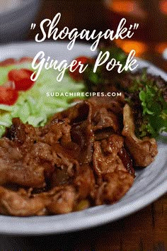 a white plate topped with meat and veggies on top of a wooden table