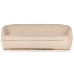 a beige couch sitting on top of a white floor