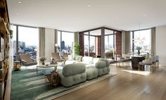 a living room filled with lots of furniture and tall windows overlooking the cityscape