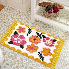 a bathroom rug with flowers on it