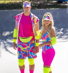 a man and woman dressed in bright clothing