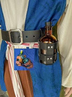 a person wearing a costume with a bottle in his pocket and belt around their waist