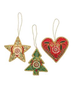 three ornaments in the shape of hearts and christmas trees are hanging from twine chains