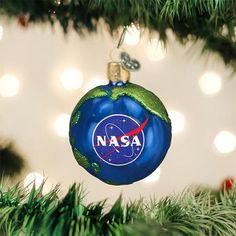 a nasa ornament hanging from a christmas tree