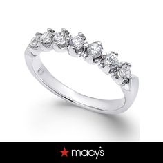 a white gold ring with five stones on the side and an inscription that says macy's