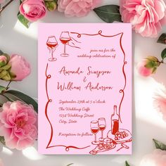 a pink wedding card with red wine and roses