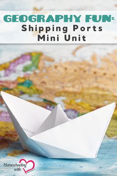 an origami boat sitting on top of a map with the words, geograph fun shipping ports mini unit