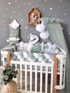 a baby crib with two stuffed animals in it