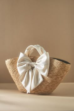 Straw, satin Bow styling Imported | Carlotta Tote by Eugenia Kim in Beige, Women's, Straw/Satin at Anthropologie Straw Purse Handbags, Spring Accessories 2024, White Straw Bag, Bride Bachelorette Outfit, Classy Purses, Bridal Clutch Bag, Spring Handbags, Breezy Outfit, Rattan Material