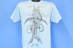 a white t - shirt with an image of the human heart and lungs on it