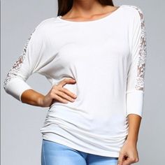 This Super Soft, 3/4 Sleeve Top Is Perfect For Weekend Brunch Or A Lunch Date! Ivory In Color, It’s Incredibly Versatile And Super Cute With The Lace Detail Across The Back Of The Shoulders And Down Each Sleeve! The Lace Is Slightly Stretchy To Give And Move With The Fabric Of The Top. Shirred On The Sides To Give A Bit Of Detail And Flow, This Top Is Long Enough To Cover All The Goodies Too! Made In The Usa! White Stretch Top With 3/4 Sleeve, White Half Sleeve Blouse For Brunch, Stretch Cream Top For Brunch, Cream Stretch Top For Brunch, Chic White Top With 3/4 Sleeves, Chic White 3/4 Sleeve Top, Stretch Brunch Top With 3/4 Sleeves, Stretch Top With 3/4 Sleeves For Brunch, Cream Half Sleeve Tops For Spring