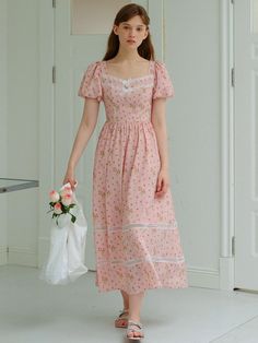 This is a casual and feminine dress by DUNDROP that is made out of high quality and sturdy fabric. With trendy design detail and young vibes, you can style it for your romantic, feminine, and casual daily outfit.- Feminine and girly mood- Lace detail on the chest and hem- Short puffy sleeves- Unique pattern print on the fabric Feminine Midi Dress With Lace Trim For Day Out, Feminine Lace Trim Midi Dress For Day Out, Cottagecore Puff Sleeve Dress For Day Out, Pink Cottagecore Dress For Summer, Feminine Cotton Midi Dress With Lace Trim, Pink Cottagecore Summer Dress, Spring Cottagecore Dress With Puff Sleeves, Spring Feminine Cotton Midi Dress, Feminine Cotton Dress With Puff Sleeves