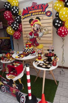 mickey mouse birthday party with balloons and decorations