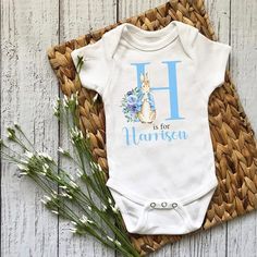 Create lasting memories with this charming blue bunny rabbit babygrow. Mark your baby boy's special moments in style and comfort! 🐰💙 #cherishedmoments #babyboyfashion #bluebunnybabygrow #personalisedgift #nostalgic #Hoolaroo Baby Boy Bunny Costume, Personalized Fitted Onesie For Spring, Baby Bunny Outfit, My First Easter Onesie, Newborn Bunny Outfit, Newborn Baby Boy Gifts, Personalised Baby Grows, Personalized Easter Gifts, Personalized Dog Gift