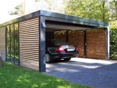 a car is parked in the garage with its door open to let people know what's inside