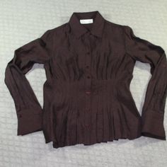 New Never Worn Cold Water Creek Button Up Top With A Ruched Front That Gives A Ruffled Bottom Illusion. Slightly Sheer With Almost A Metallic Sheen. The Cut Of This Top Is Fitted. It Is A Dark Chocolate Brown, Very Beautiful Color. New Without Tags Size: Petite Xsmall. Happy To Answer Questions, Bundle With Other Items To Save On Shipping And Take Reasonable Offers. New To Poshmark? Enter Code Style_exchange During Sign-Up To Get $10 Off Your First Order! The Actual Color Of The Item May Vary Sl Fitted V-neck Shirt With Button Cuffs, Fitted V-neck Shirt With Button Closure, Fitted Shirt With Buttons For Daywear, Brown Tops With Button Closure For Daywear, Brown Formal Top With Button Cuffs, Fitted Button-up Top With Button Cuffs, Formal Brown Top With Button Cuffs, Formal Brown Tops With Button Cuffs, Fitted Tops With Covered Buttons For Office