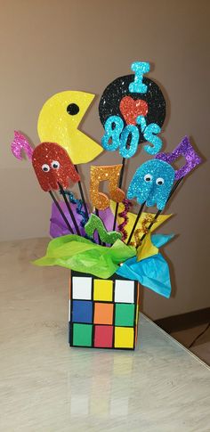 a vase filled with lots of different colored items