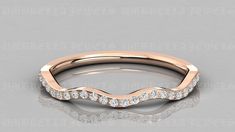 a rose gold wedding band with white diamonds on the top and bottom, set in 18k