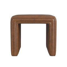 a brown leather stool with three legs