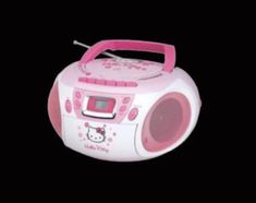 a pink hello kitty boombox on a black background